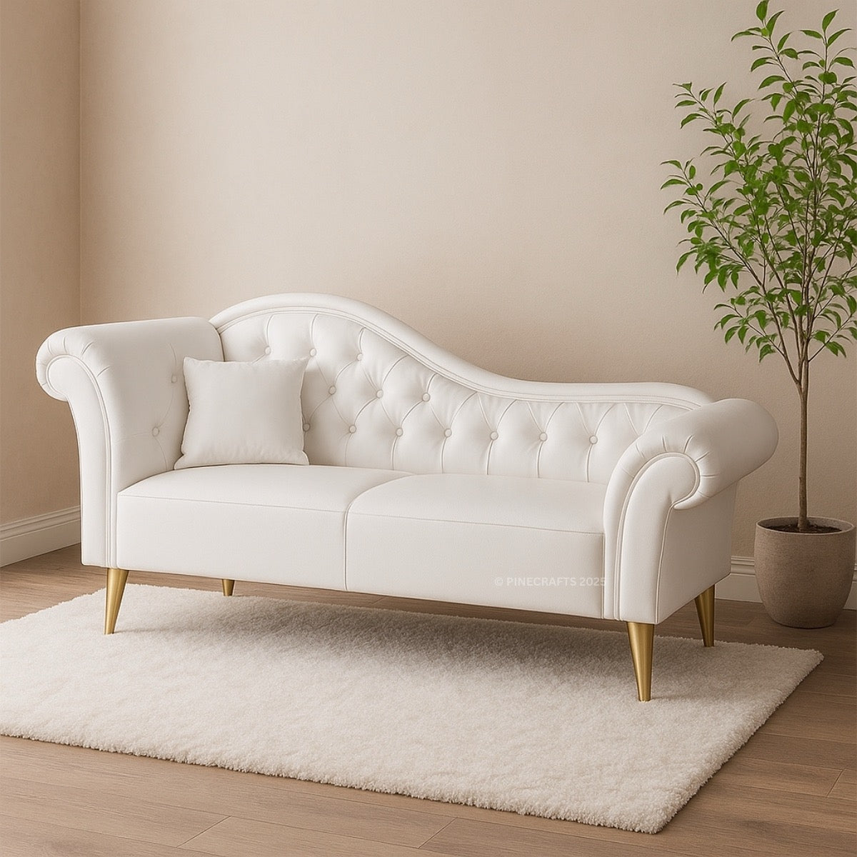 White tufted sofa in a room with a beige wall and a plant.