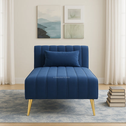 Blue armchair with gold legs in a room with light-colored walls and a rug.