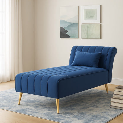 Blue chaise lounge in a room with light-colored walls and decor
