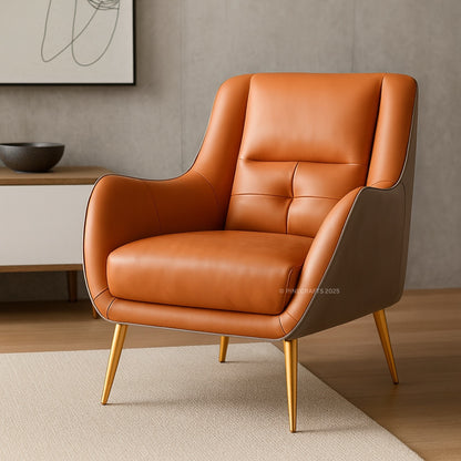 Brown leather armchair with gold legs in a modern interior setting