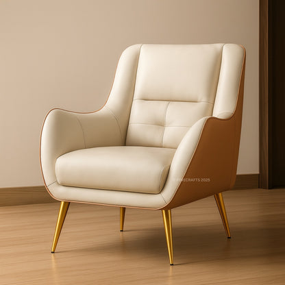 Beige armchair with gold legs on a wooden floor and beige wall background