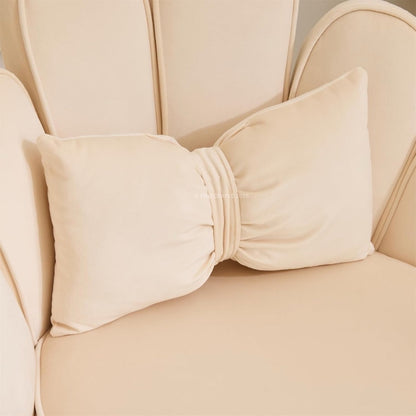 Beige chair with a large bow detail on the backrest