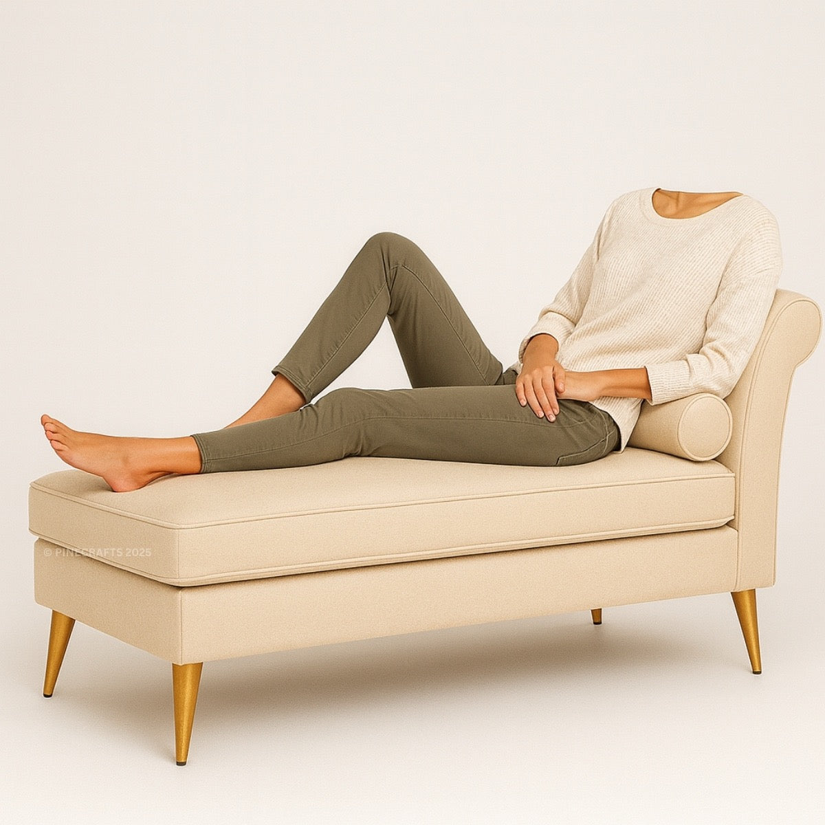 Person sitting on a beige bench with gold legs against a plain background