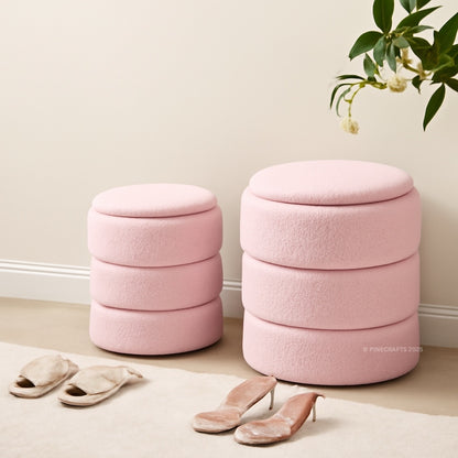 Two pink ottomans with stacked design in a room setting.