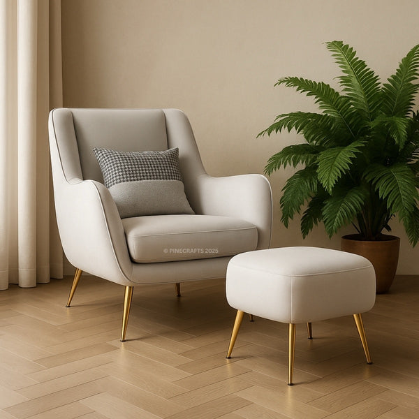 Beige armchair with a matching ottoman and a plant in a room with beige walls and wooden floor.