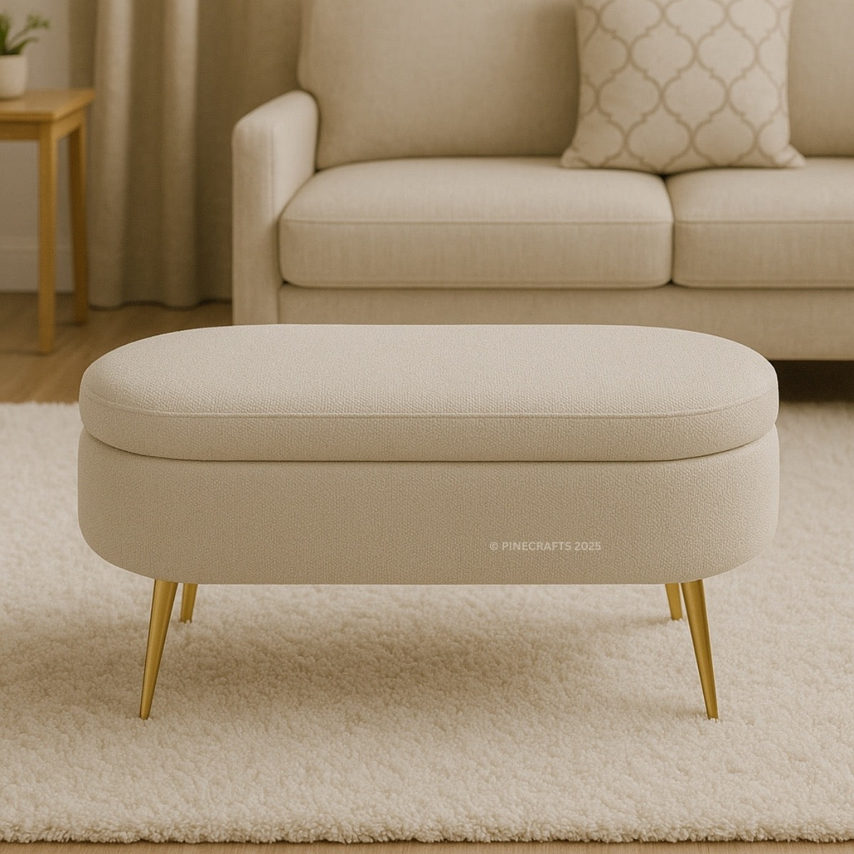 Beige ottoman with gold legs in a living room setting
