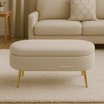 Beige ottoman with gold legs in a living room setting
