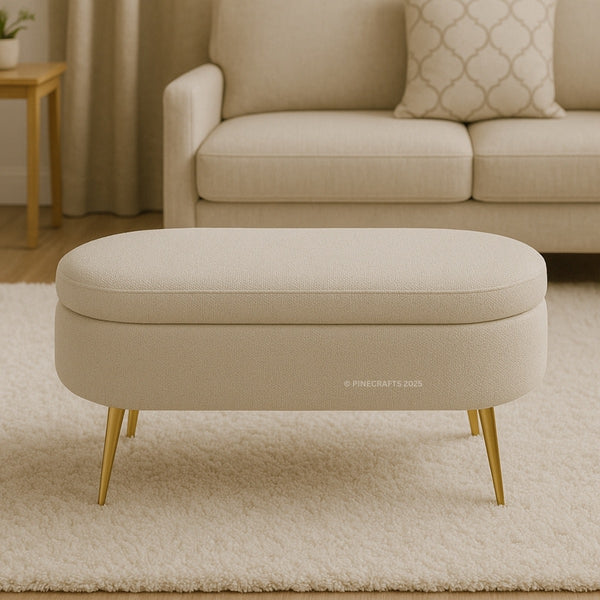 Beige ottoman with gold legs in a living room setting
