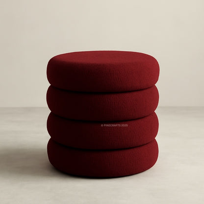 Stack of red cushions on a beige background