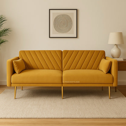 Yellow sofa in a living room setting with a lamp and artwork on the wall.