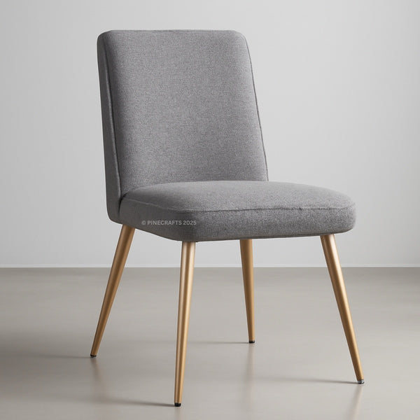Gray upholstered chair with gold legs on a plain background