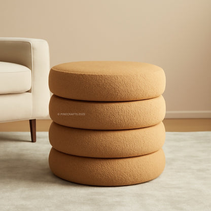 Stack of brown textured ottomans in a room with a beige sofa.