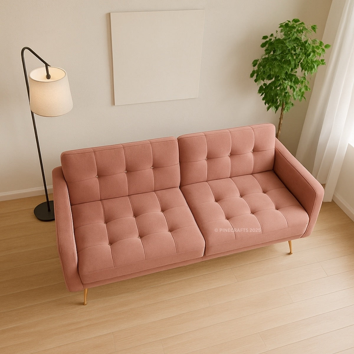 Pink sofa in a room with a lamp and plant