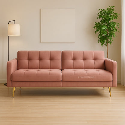 Pink sofa in a room with a lamp and plant
