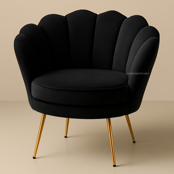 Black armchair with gold legs on a beige background