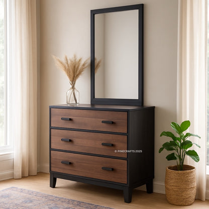 Wooden dresser with mirror and plant in a room with curtains and rug.