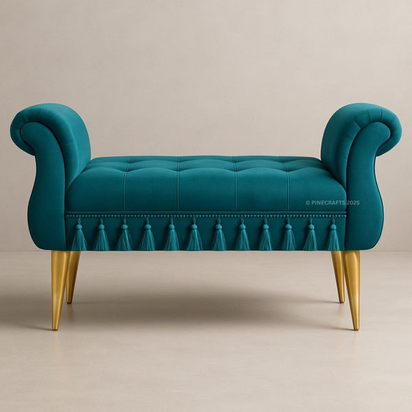 Teal bench with tufted backrest and gold legs on a beige background