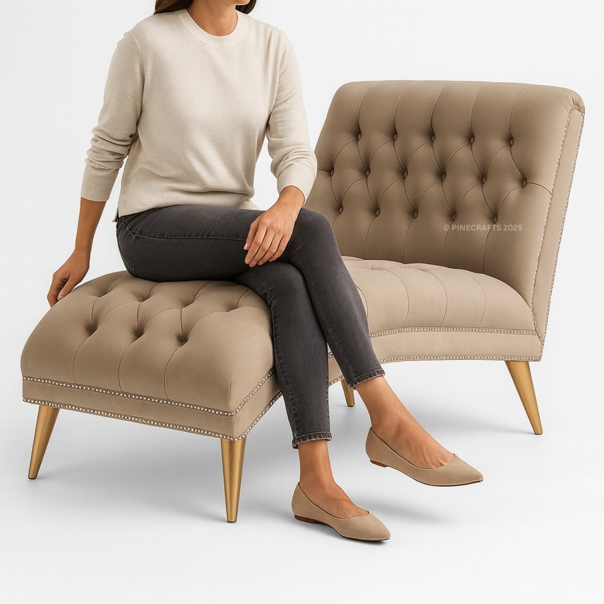 Person sitting on a beige tufted chair and ottoman with a white background