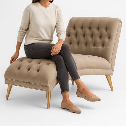 Person sitting on a beige tufted chair and ottoman with a white background