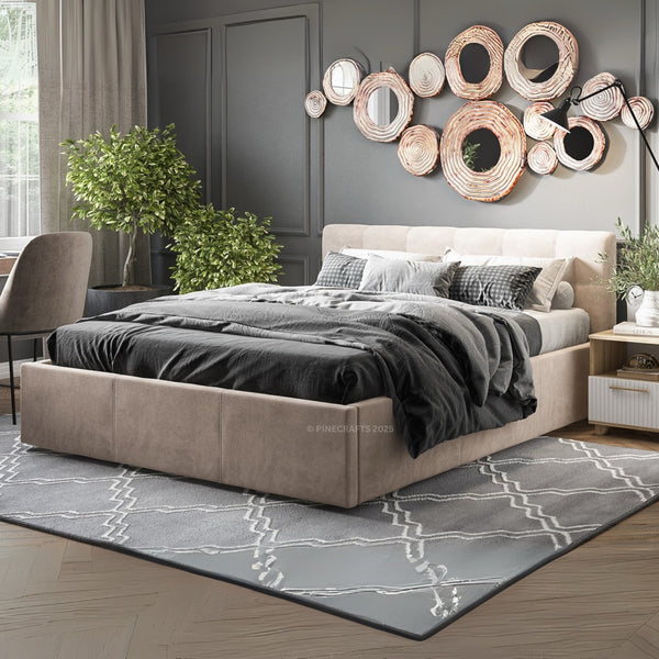 Modern bedroom with a bed, decorative wall mirrors, and plants.