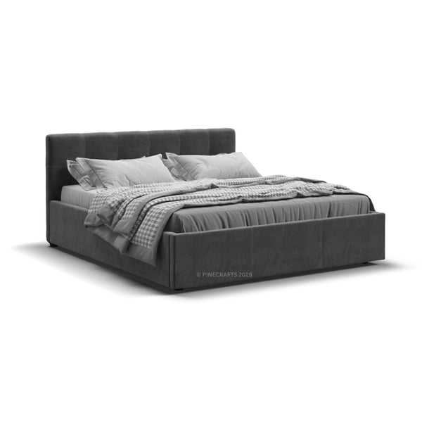 Gray upholstered bed with bedding on a white background