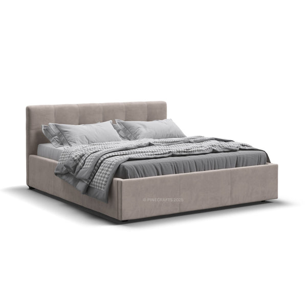 Beige upholstered bed with gray bedding on a white background