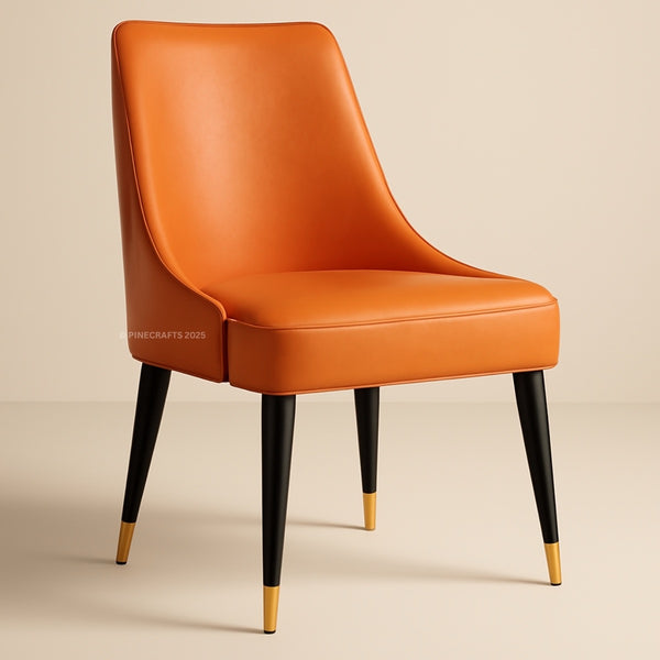 Orange chair with black legs and gold tips on a beige background