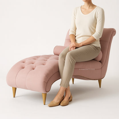 Person sitting on a pink chair with matching ottoman against a white background