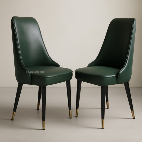 Two green chairs with gold feet on a neutral background