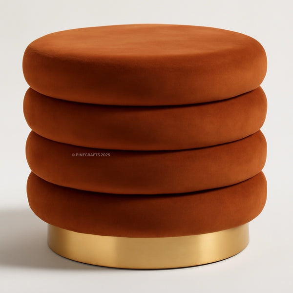 Stack of brown ottomans with a gold base on a white background