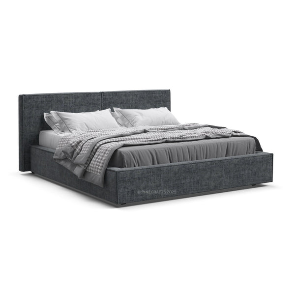 Gray upholstered bed with bedding on a white background