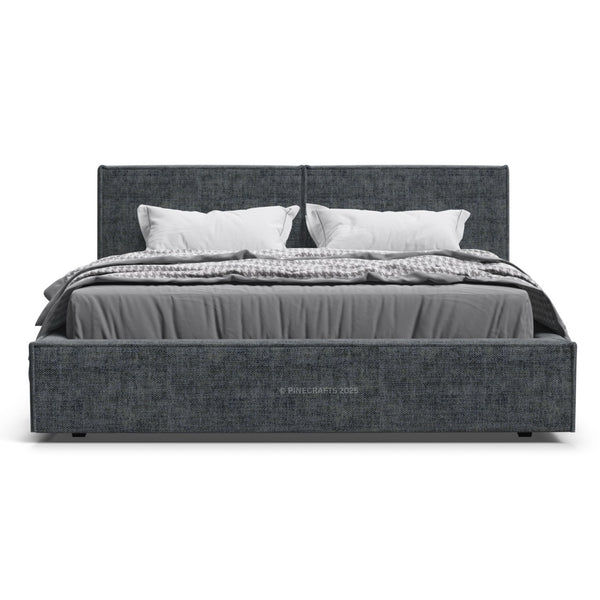 Gray upholstered bed with white bedding on a white background