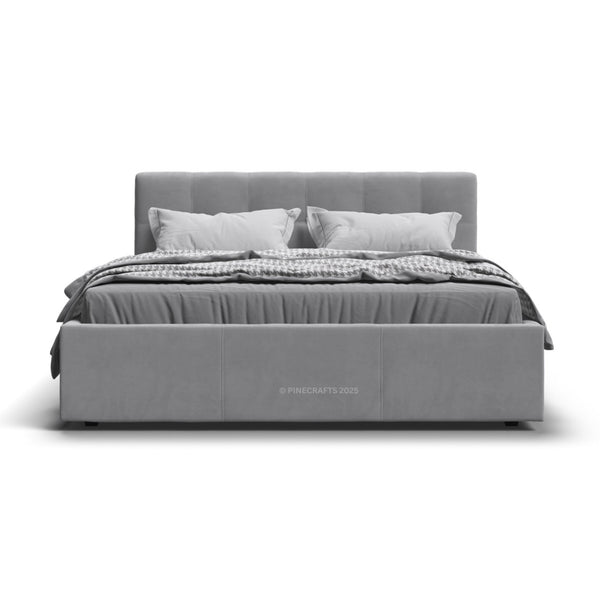 Gray upholstered bed with white bedding on a white background