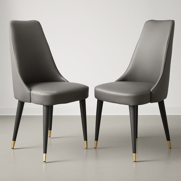 Two gray chairs with gold feet on a light gray background