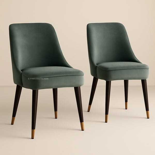 Two green chairs with wooden legs on a beige background