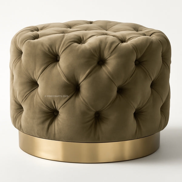 Green tufted ottoman with a gold base on a white background