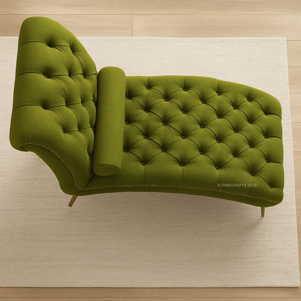 Green tufted chaise lounge on a beige rug with wooden floor