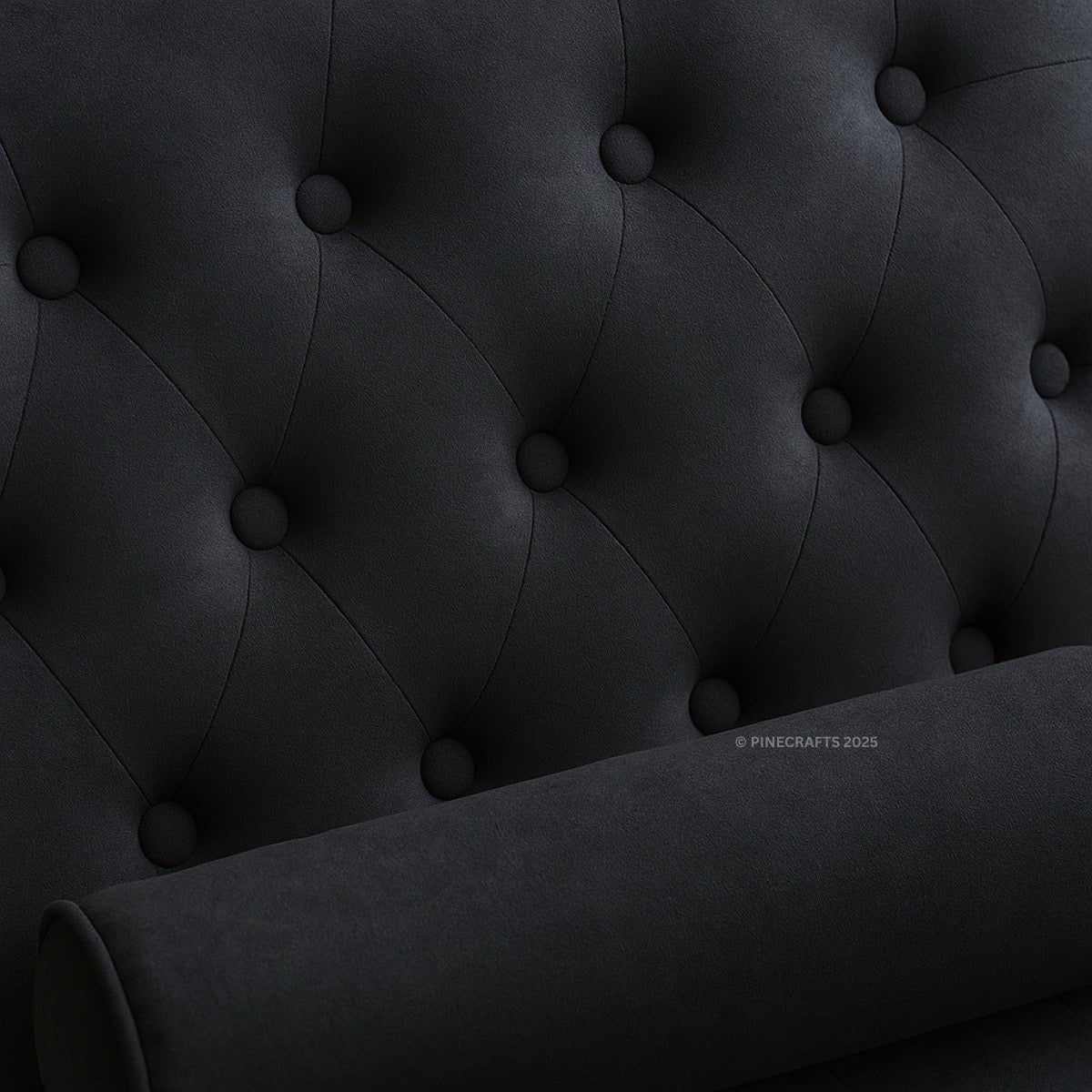 Close-up of a dark gray tufted headboard with visible brand name.