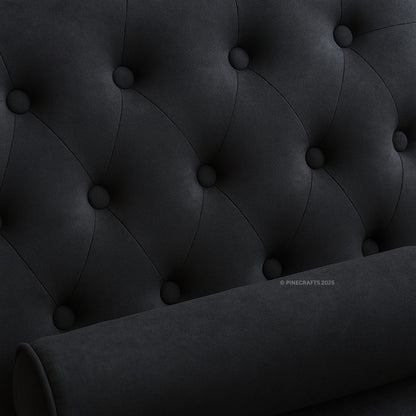 Close-up of a dark gray tufted headboard with visible brand name.