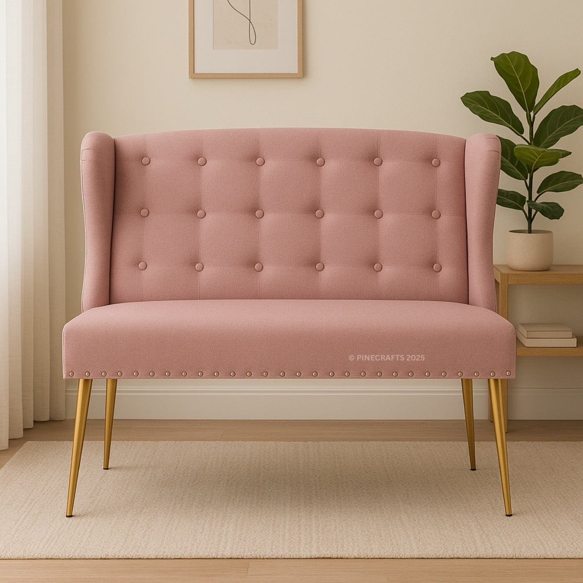 Pink tufted bench with gold legs in a room setting