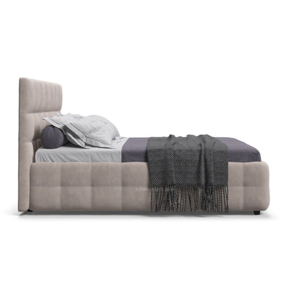 Modern bed with gray bedding and a blanket on a white background
