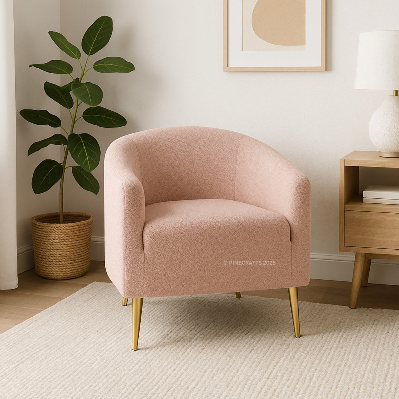 Pink armchair in a room with a plant and side table.