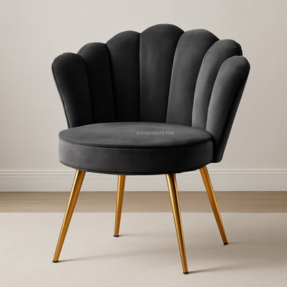 Gray chair with scalloped backrest and gold legs on a neutral background
