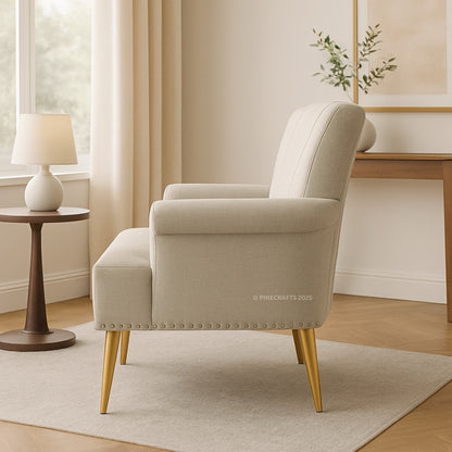 Beige armchair in a room with a side table and lamp