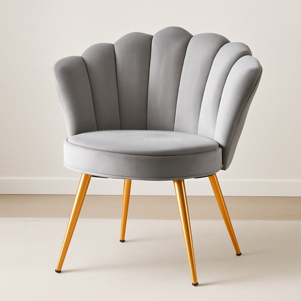 Gray shell-back chair with gold legs on a plain background
