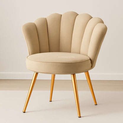 Beige armchair with scalloped backrest and gold legs on a neutral background