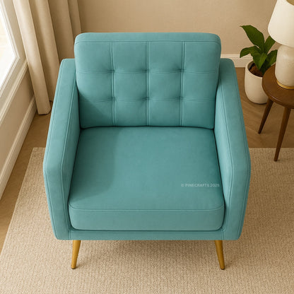 Teal armchair with gold legs in a room setting