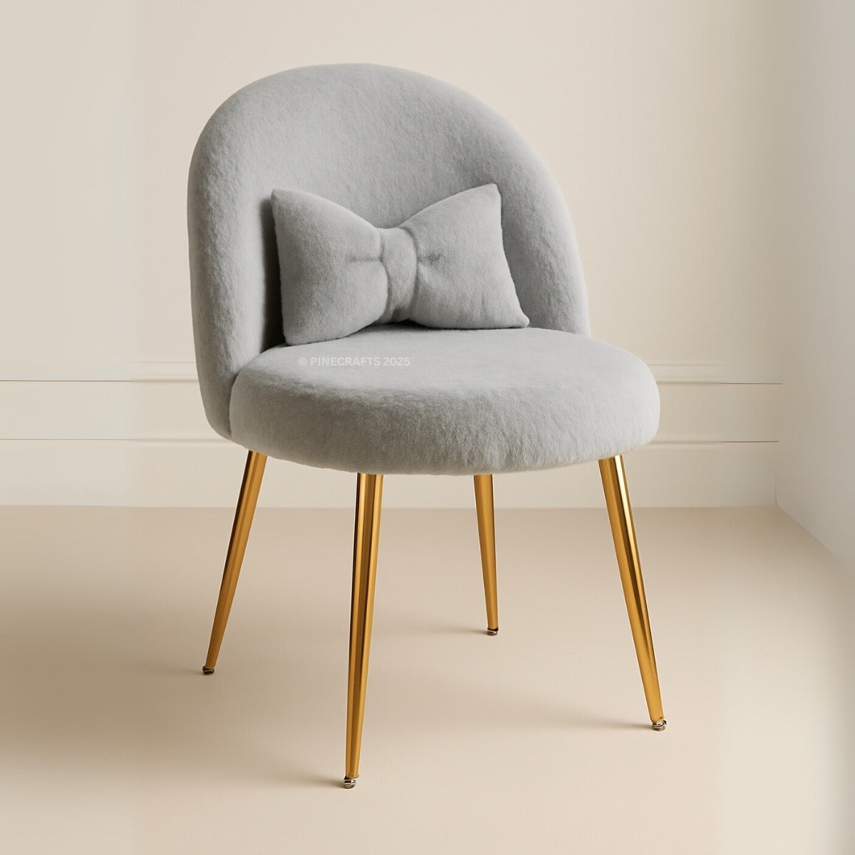 Gray chair with gold legs on a beige background