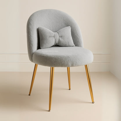 Gray chair with gold legs on a beige background