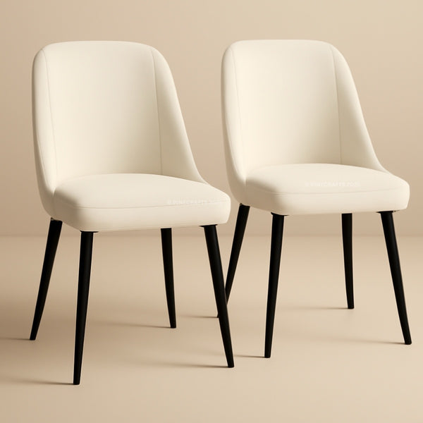 Two white chairs with black legs on a beige background